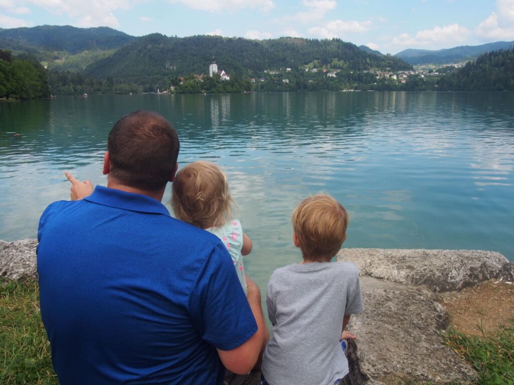 Sitting at Lake Bled with kids