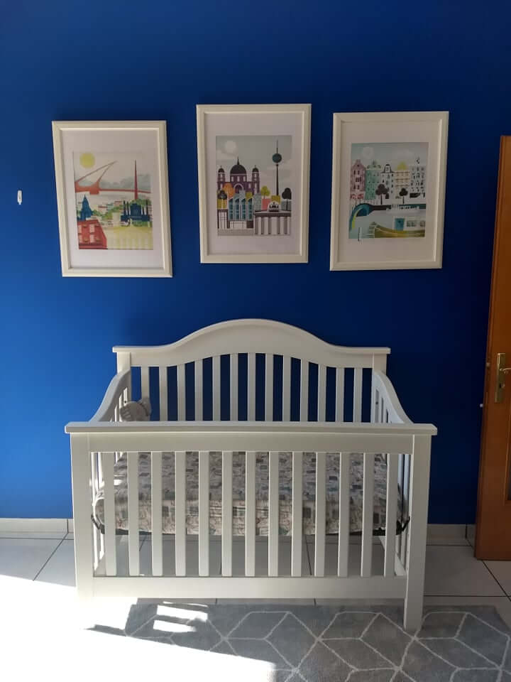 travel-themed nursery for a boy, blue accent wall